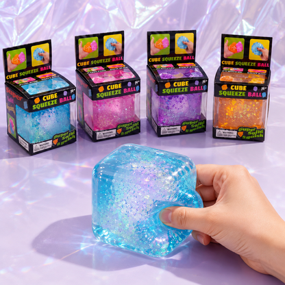Boxed 5 cm aurora gel cube color options with a hand squeezing the blue cube