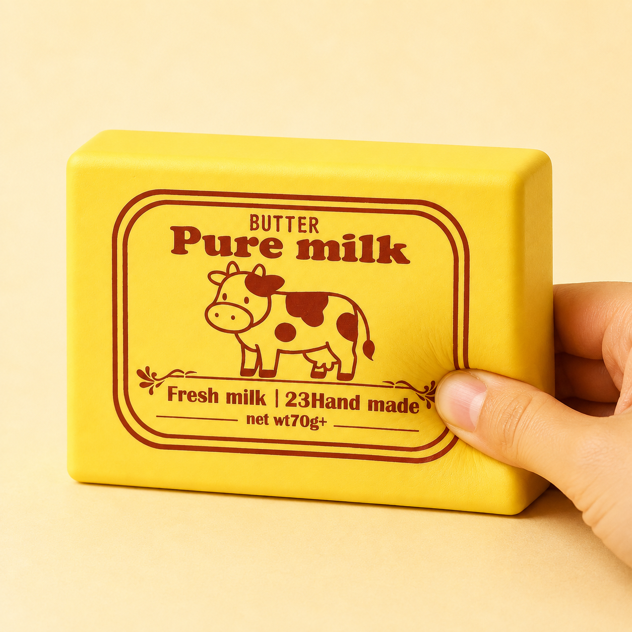 Butter milk block squishy shown being pressed by hand