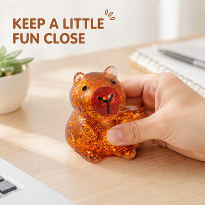 Amber gel capybara on a bright home-office desk