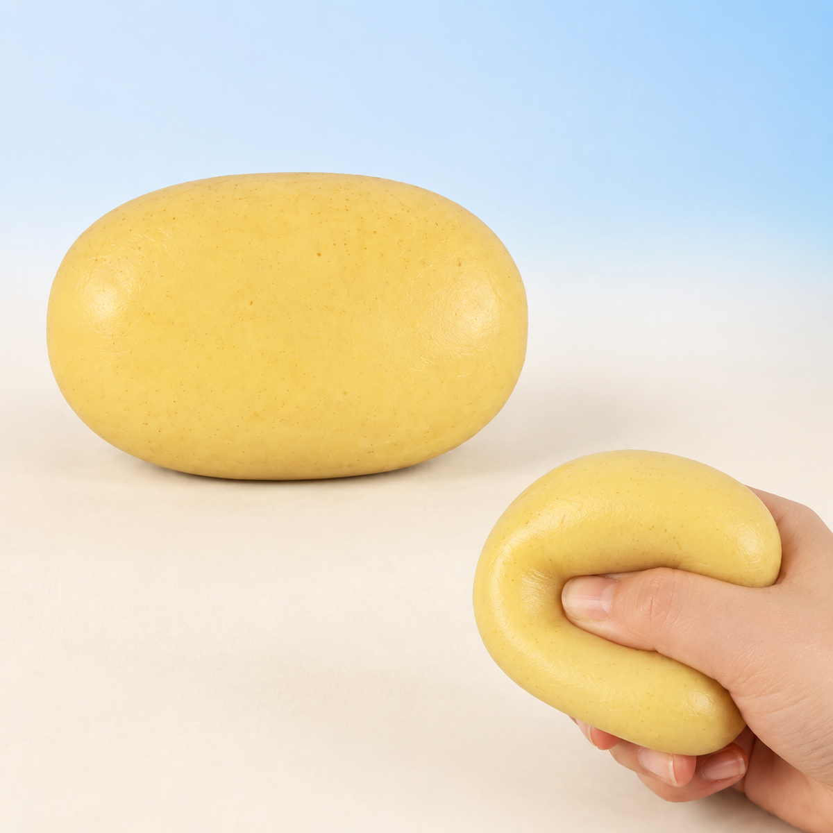 Fluid-filled small potato sensory squeeze toy hero with hand-squeeze demonstration