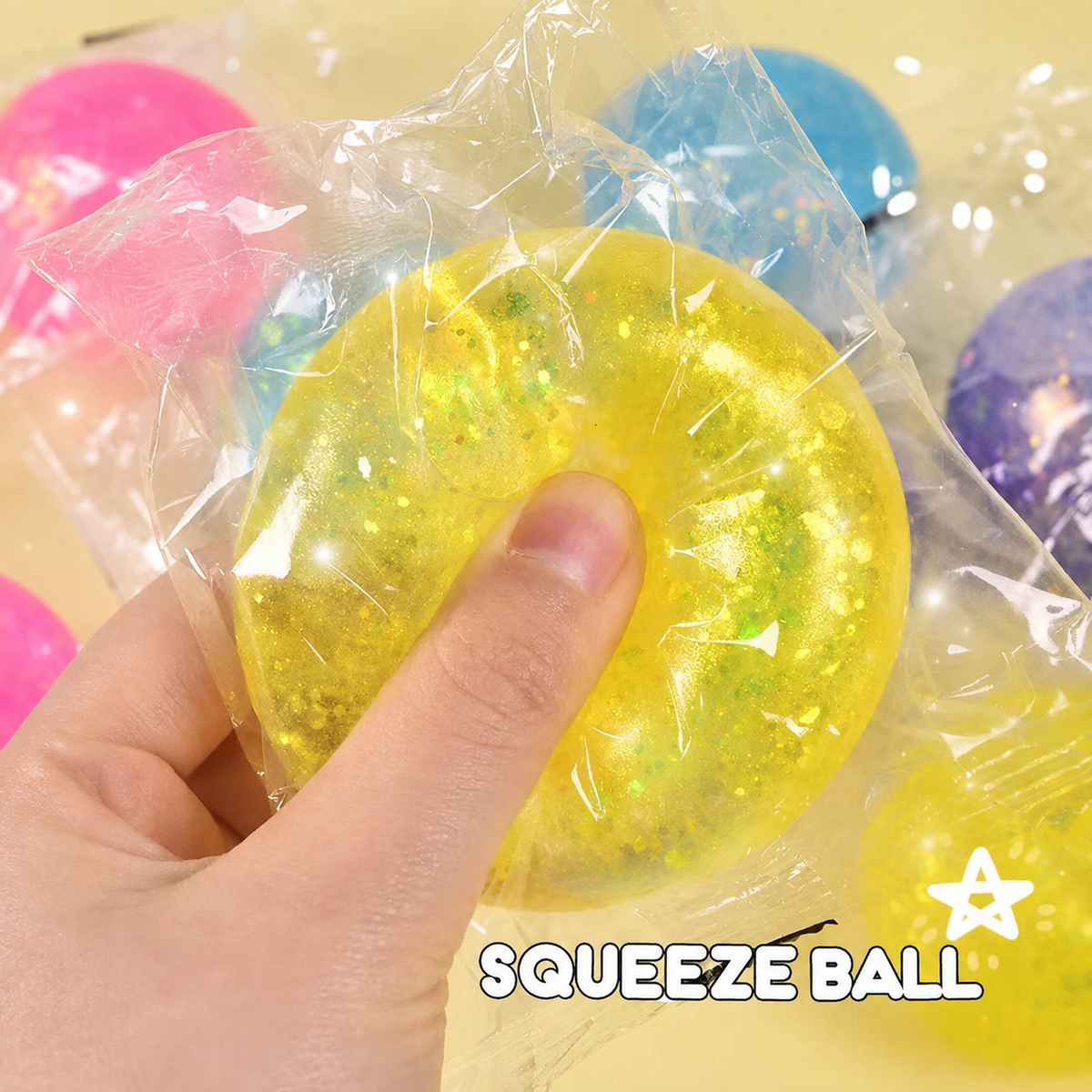 Yellow translucent glitter squeeze ball, supplier text removed