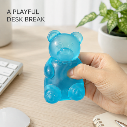 Blue translucent gel bear on a bright home-office desk