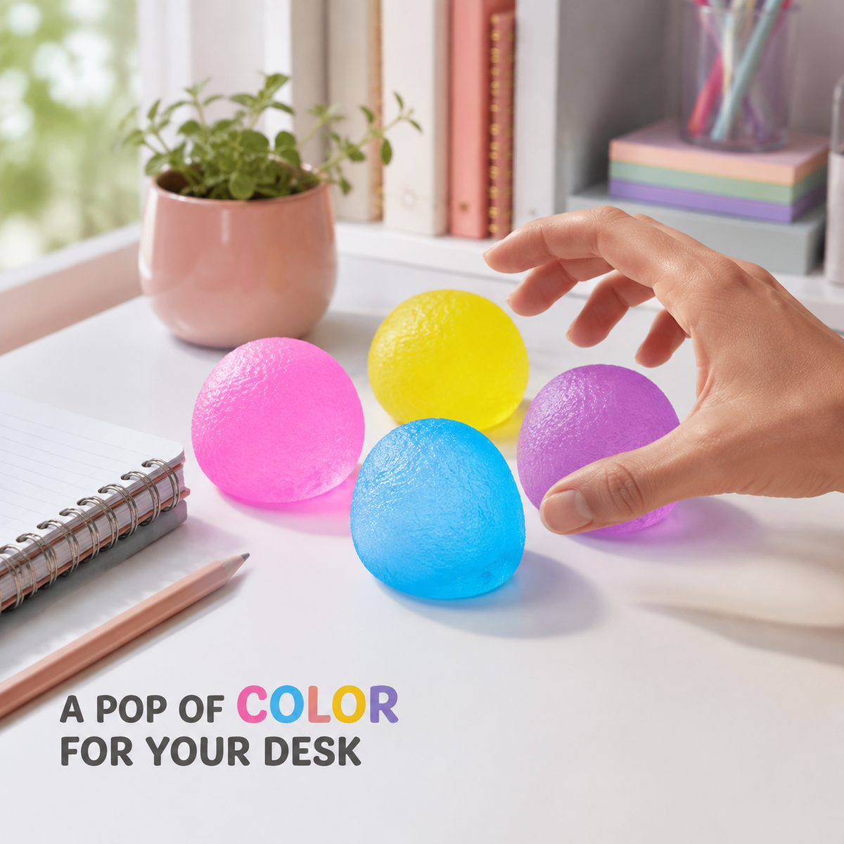 Four mini colourful candy gel toys on a bright home-office desk
