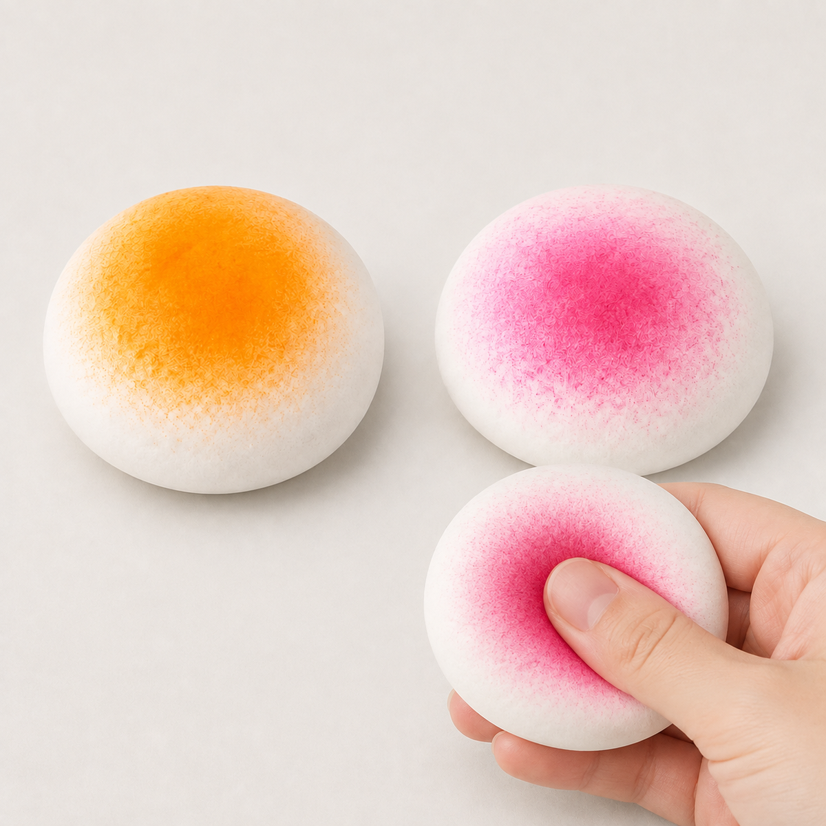 Mango and strawberry mochi fluid-filled sensory squeeze toy hero and squeeze action