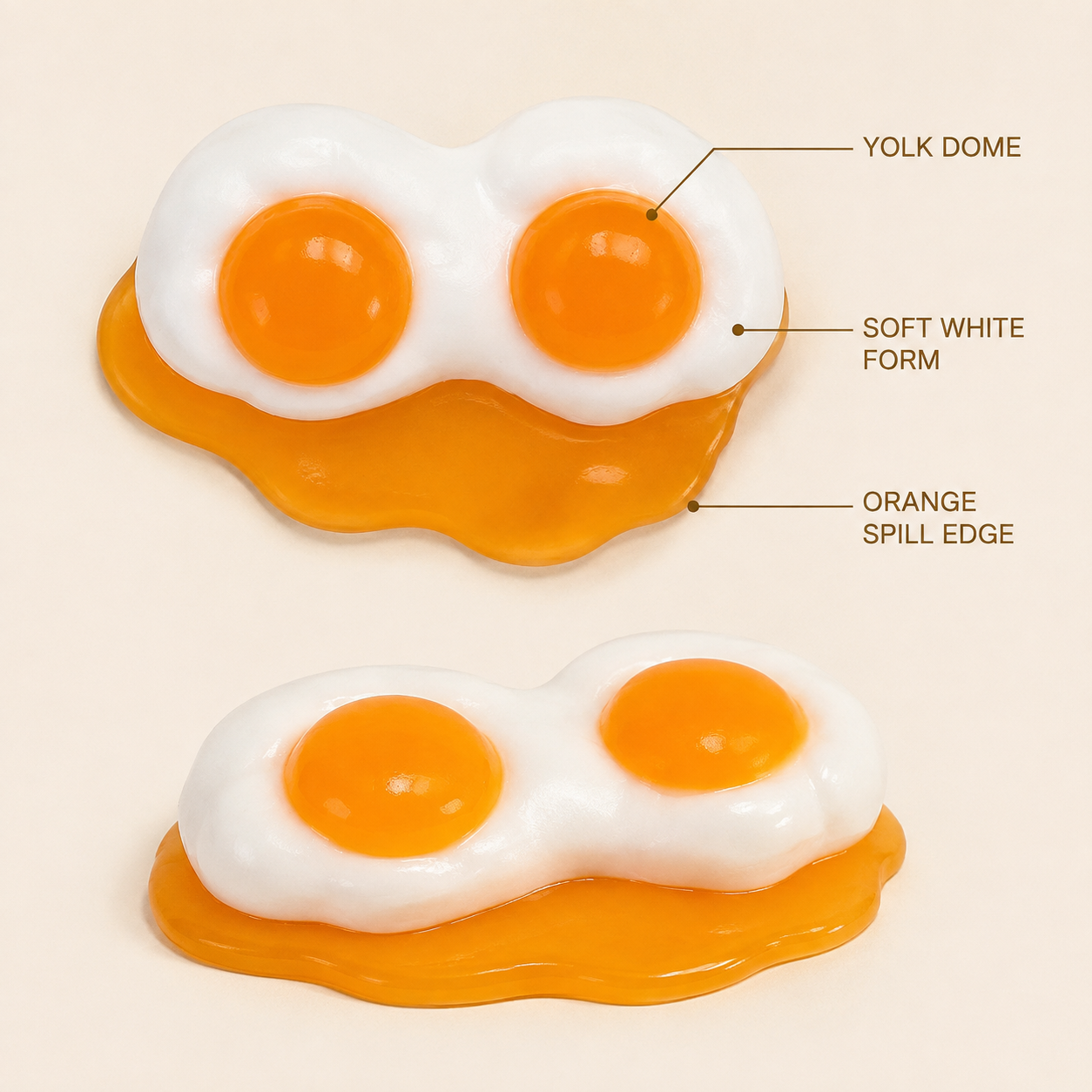 Double-yolk toy yolk dome white form and orange spill edge