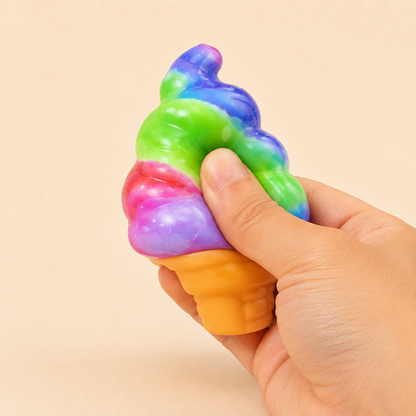 Rainbow soft-serve squishy toy being visibly squeezed