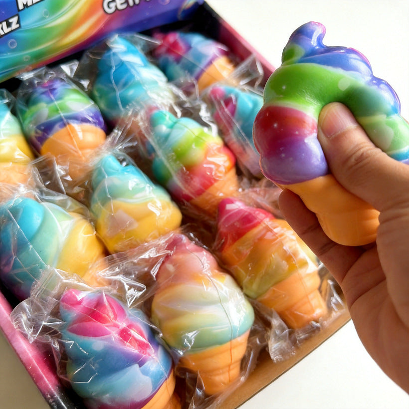 Rainbow soft-serve squishy being squeezed by hand