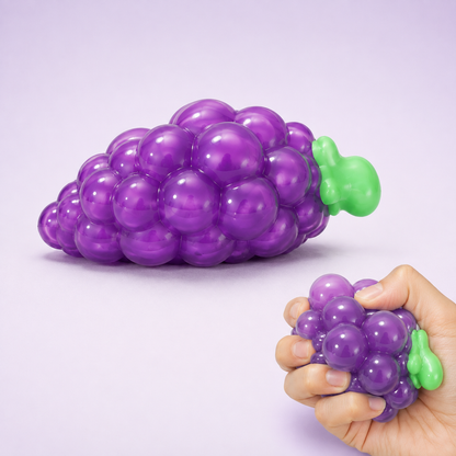 Purple grape sensory squeeze toy hero with hand squeeze