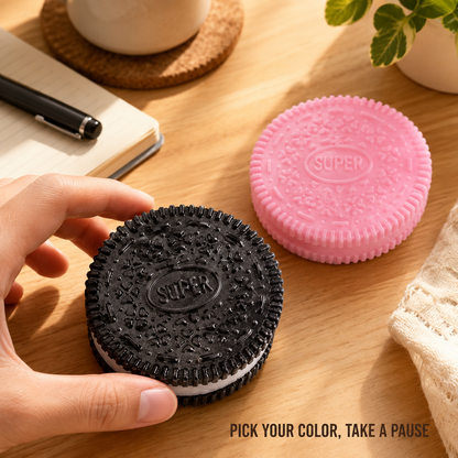 Black and pink sandwich-cookie sensory toys in a desk scene