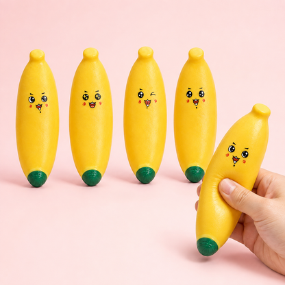Four assorted smiley banana sensory squeeze toys hero with hand squeeze
