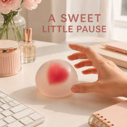 Strawberry mochi gel ball on a bright blush home-office desk
