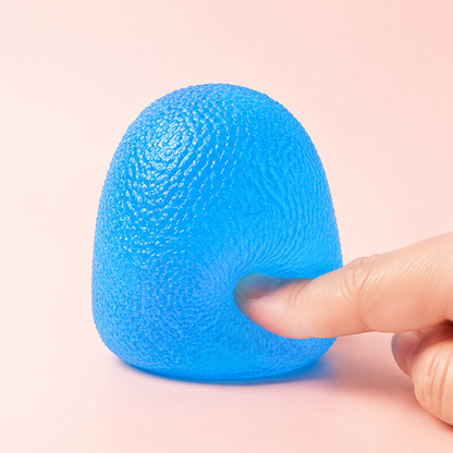 Blue textured dome squeeze toy with hand pressing the side